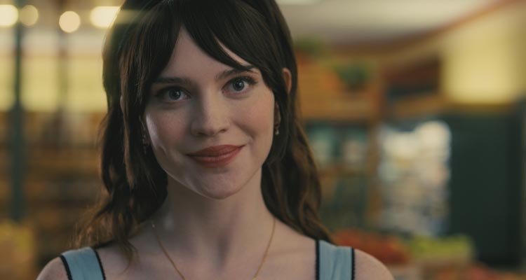 Companion 2025 Movie Scene Sophie Thatcher as Iris in the supermarket falling in love with Josh