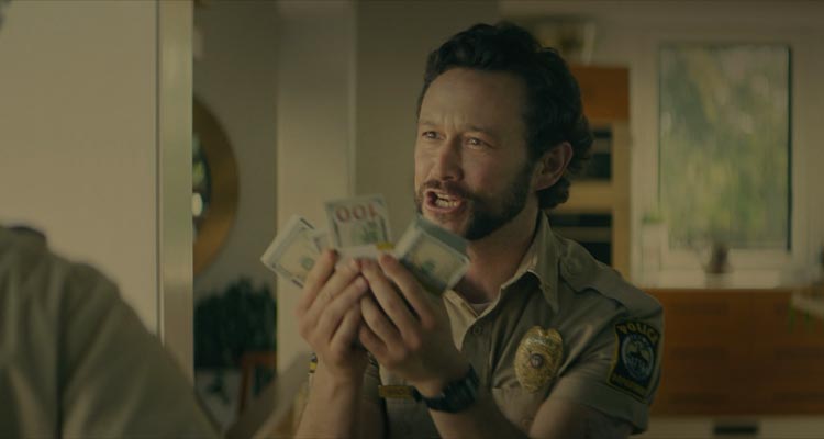 Greedy People 2024 Movie Scene Joseph Gordon-Levitt as Terry holding wads of cash in his hands to his partner