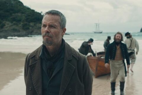 The Convert 2023 Movie Scene Guy Pearce as Thomas Munro arriving at the shores of New Zealand