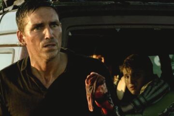 Transit 2012 Movie Scene Jim Caviezel as Nate with a bloody hand in front of a car with his family in it