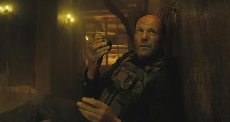 A Working Man 2025 Movie Scene Jason Statham as Levon Cade throwing a grenade at the bad guys