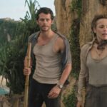 Send Help 2026 Movie Scene Rachel McAdams as Linda Liddle and Dylan O'Brien as Bradley Preston standing on the edge of the cliff on an uninhabited island