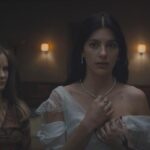 Something Very Bad is Going to Happen 2026 Miniseries Scene 23 Camila Morrone as Rachel in a wedding dress with Jennifer Jason Leigh as Victoria standing next to her