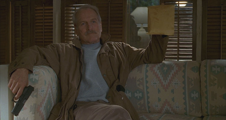 Twilight 1998 Movie Scene Paul Newman as Harry Ross holding a gun and a bag