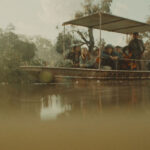 Hungry 2026 Movie Scene Tourists in a boat waiting to see gators with a killer hippo lurking in the water