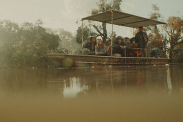 Hungry 2026 Movie Scene Tourists in a boat waiting to see gators with a killer hippo lurking in the water
