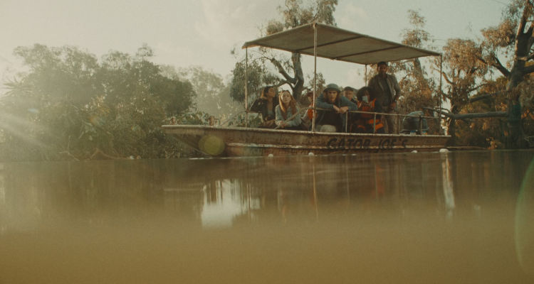 Hungry 2026 Movie Scene Tourists in a boat waiting to see gators with a killer hippo lurking in the water