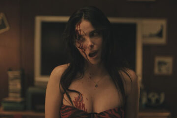 Obsession 2025 Movie Scene Inde Navarrette as Nikki with a bloody head after stabbing herself with a bottle