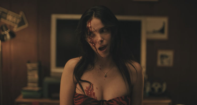 Obsession 2025 Movie Scene Inde Navarrette as Nikki with a bloody head after stabbing herself with a bottle